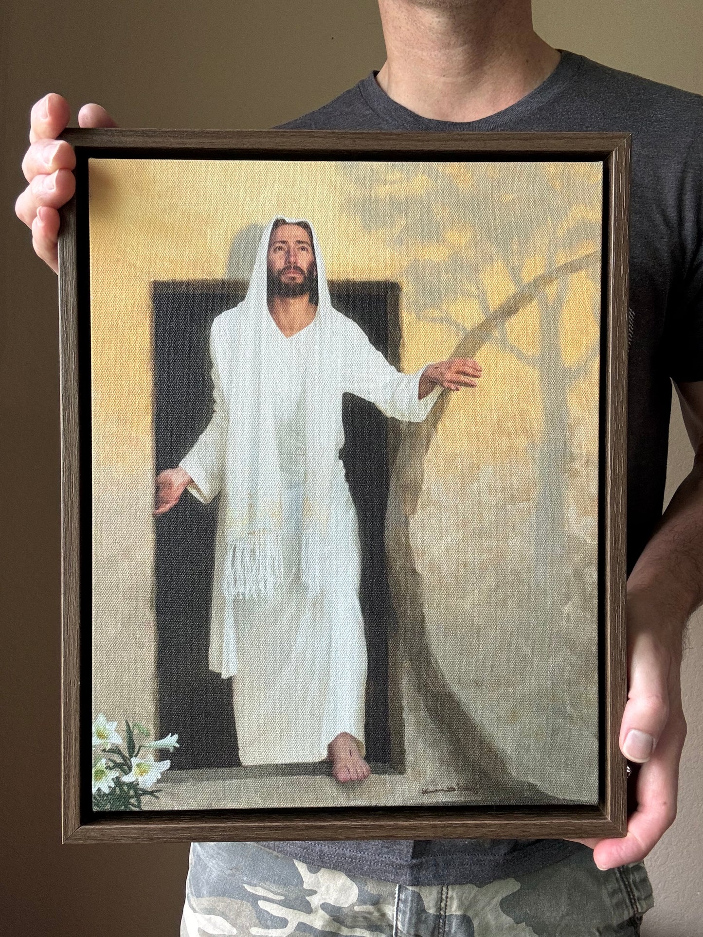 framed canvas painting of the resurrected Christ emerging from the tomb bathed in radiant morning light rays