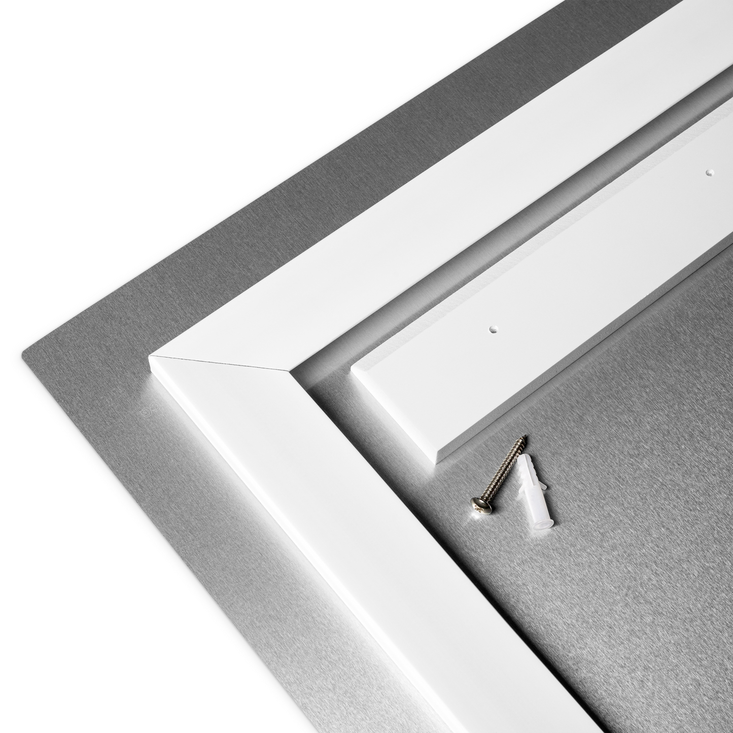Close-up of a white picture frame with a screw on a white background